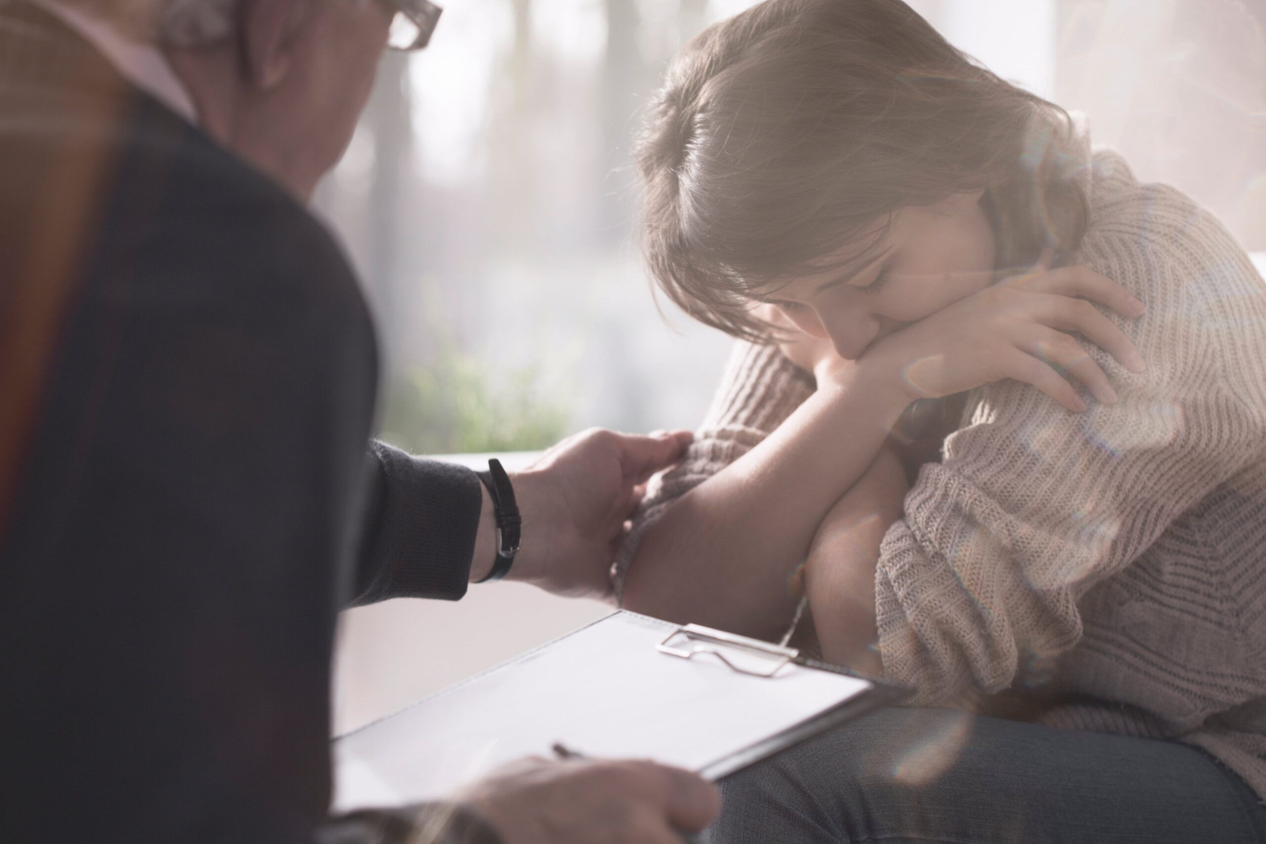 A woman is comforted during trauma Therapy in kentucky.