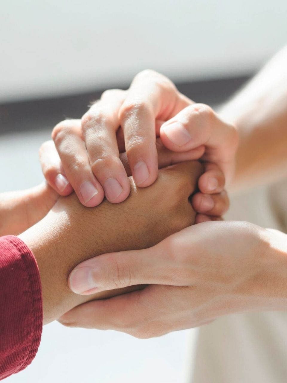 A professional offers support to a client during a 12-step program in Kentucky.