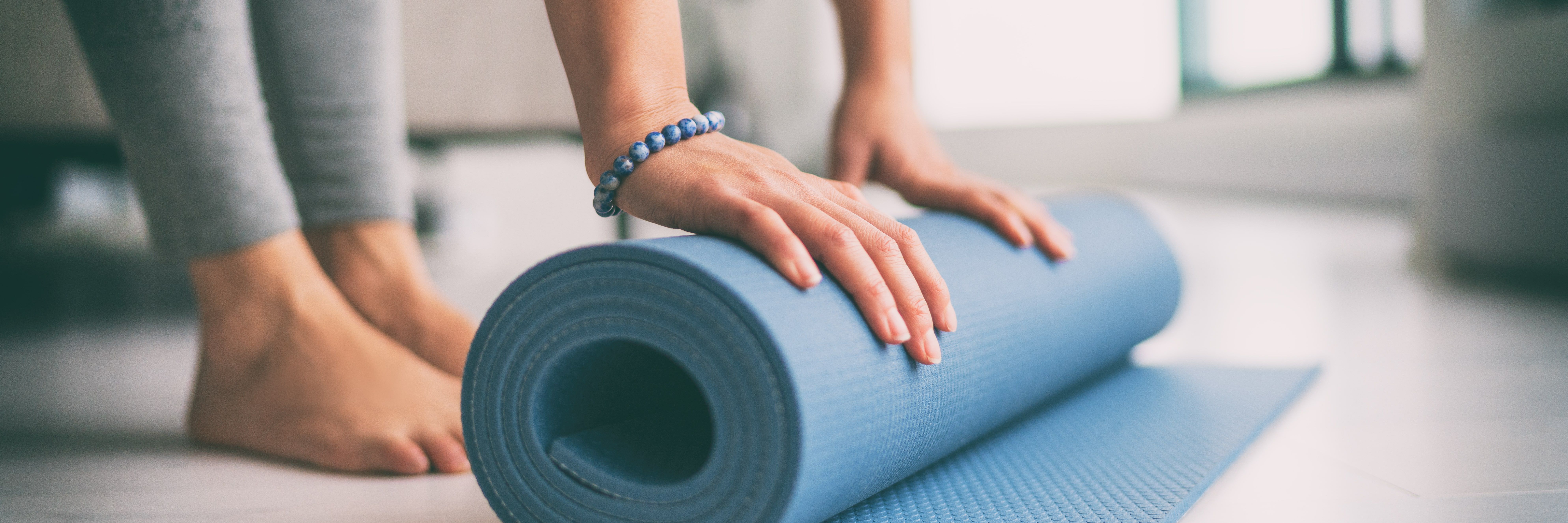 A woman enjoying a meditation and yoga session during Holistic Therapy kentucky